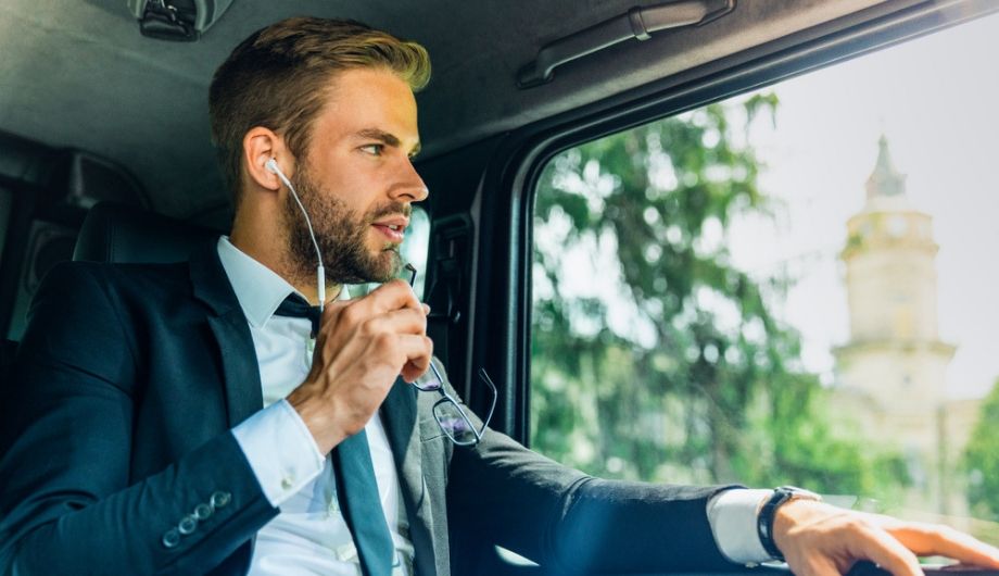 man listening to music in car